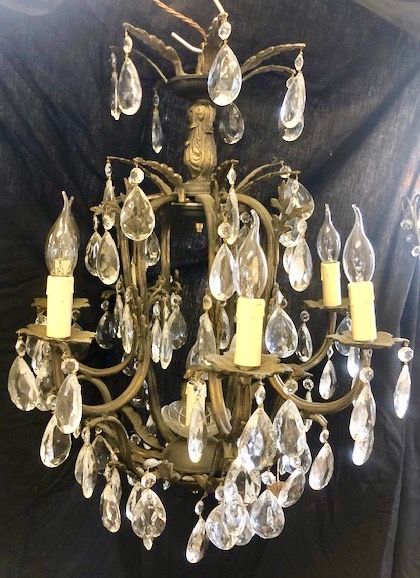 a french dark framed eight light antique chandelier