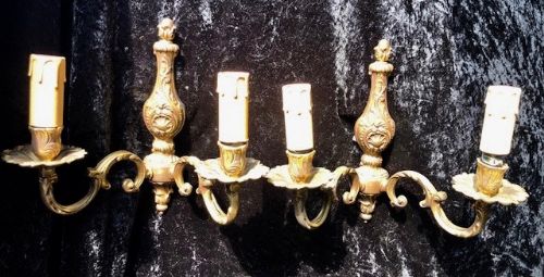 a pair of two light french brass walllights