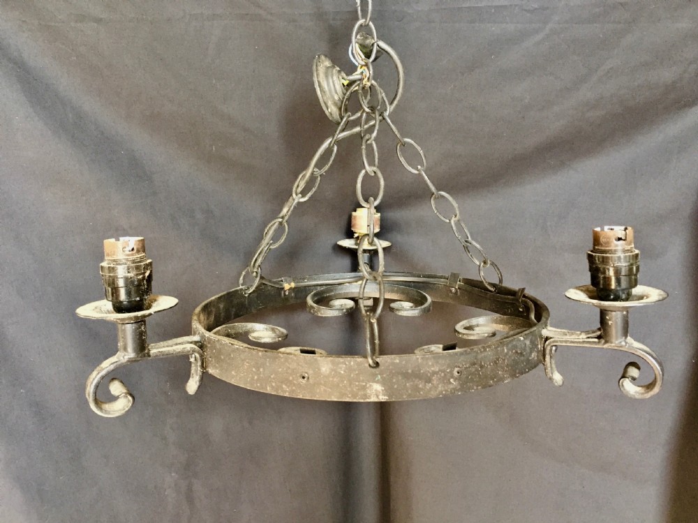 three light wrought iron wagon wheel chandelier
