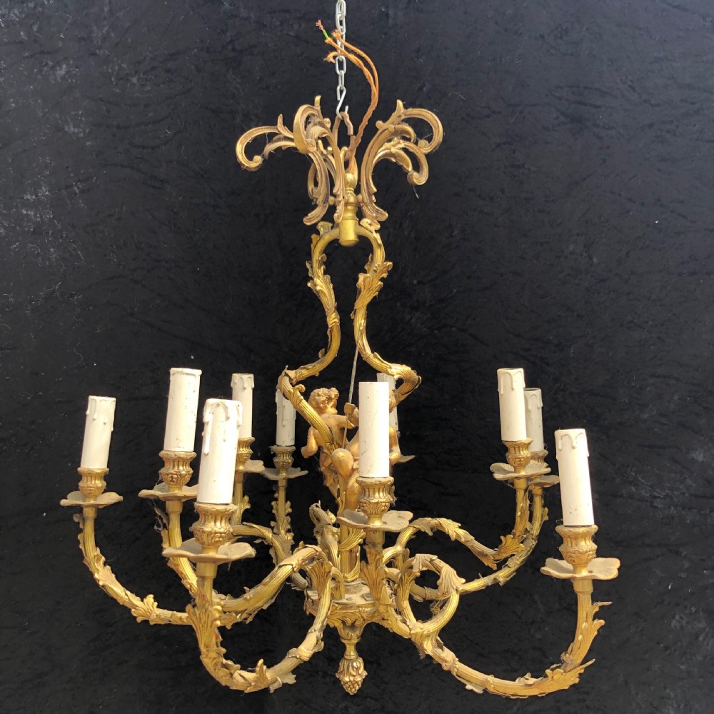 a ten light french gilt cherub antique chandelier