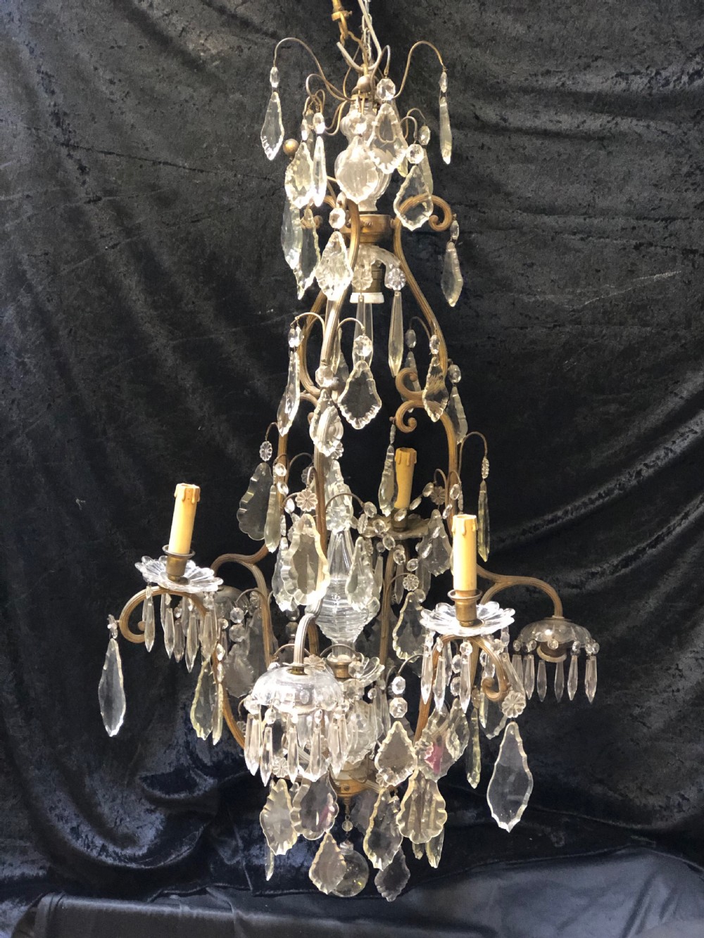 a unique french antique chandelier with 9 lights