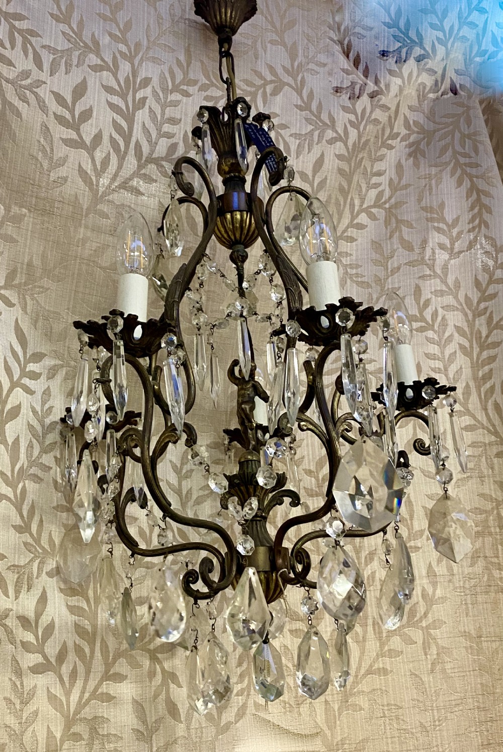 a five light italian dark framed cherub antique chandelier