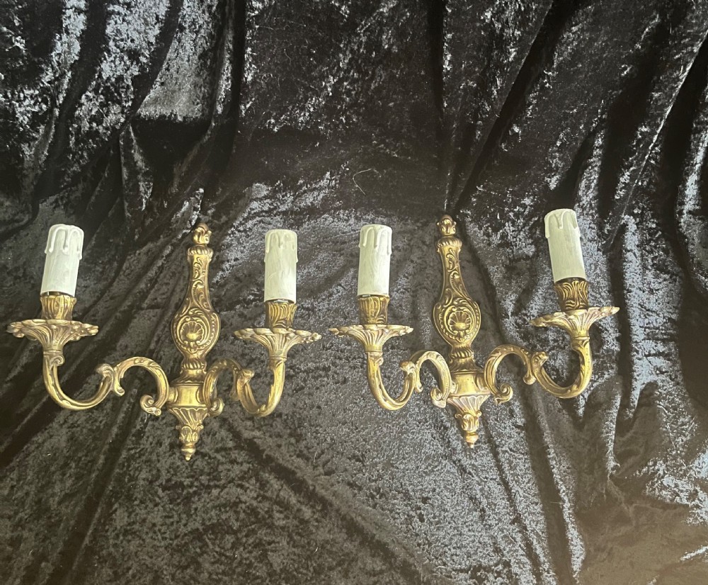 a pair of twin light antique french brass wall lights