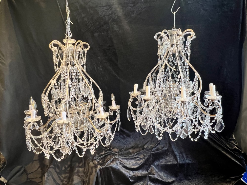 a pair of eight light florentine antique chandeliers