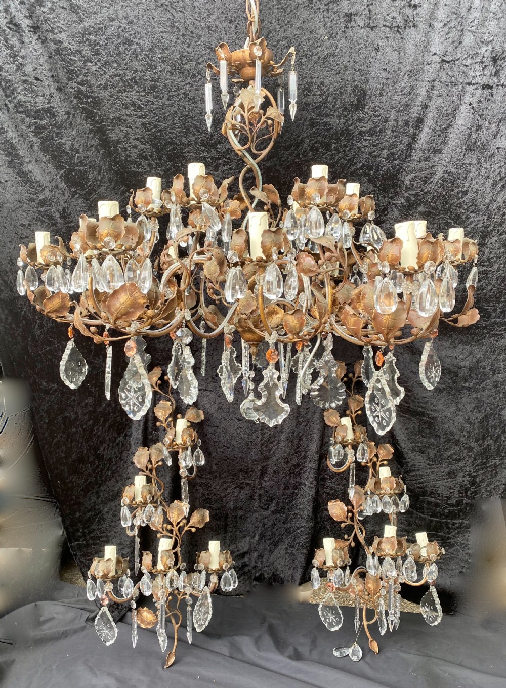 a pair of large italian rustic leafy italian twelve light chandeliers with or without wallights