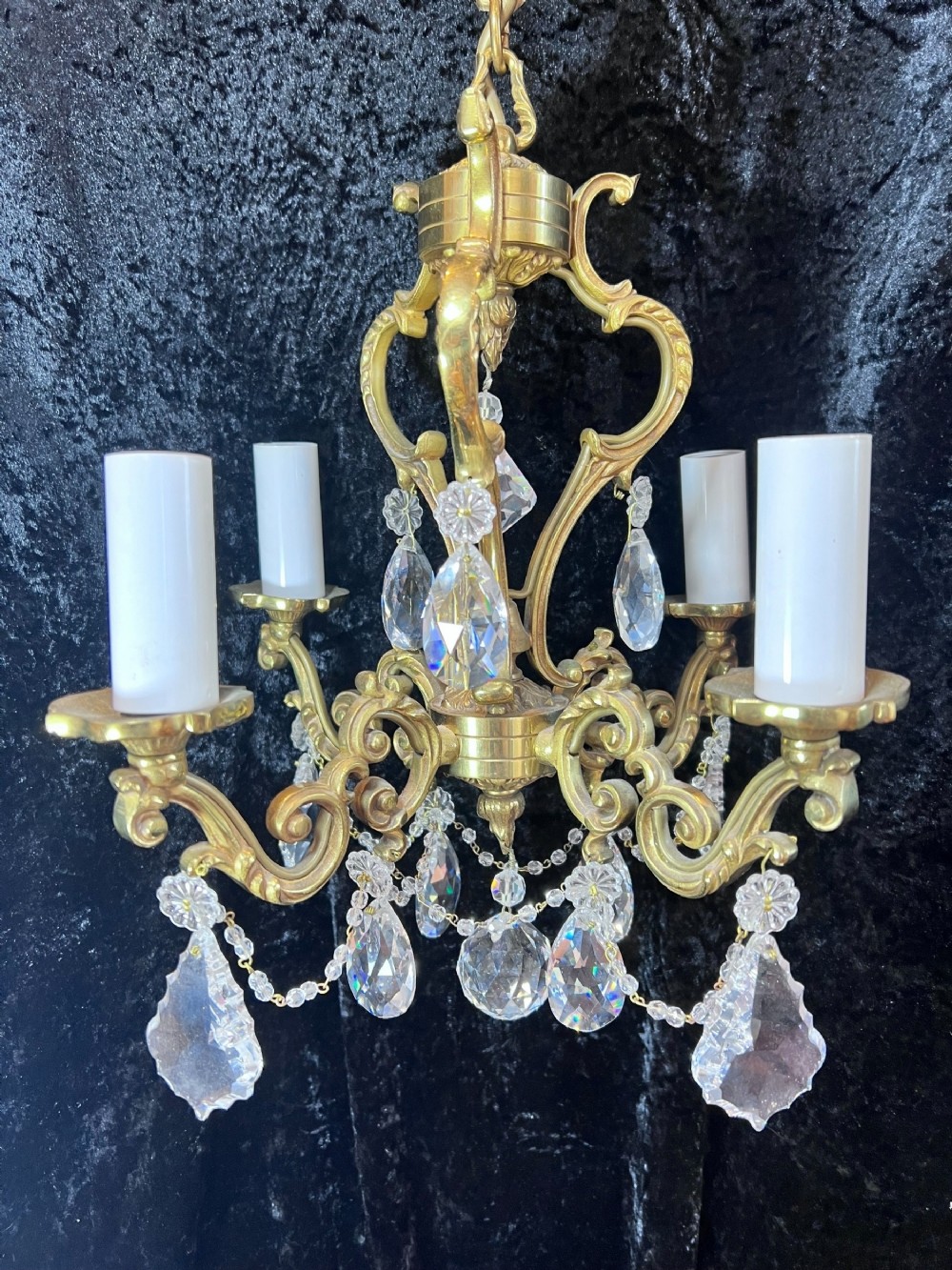 a four light antique gilt brass french chandelier