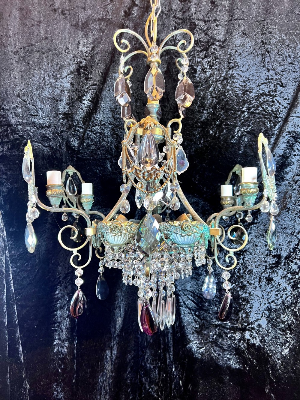 an unusual french antique nine light antique chandelier with coloured crystals