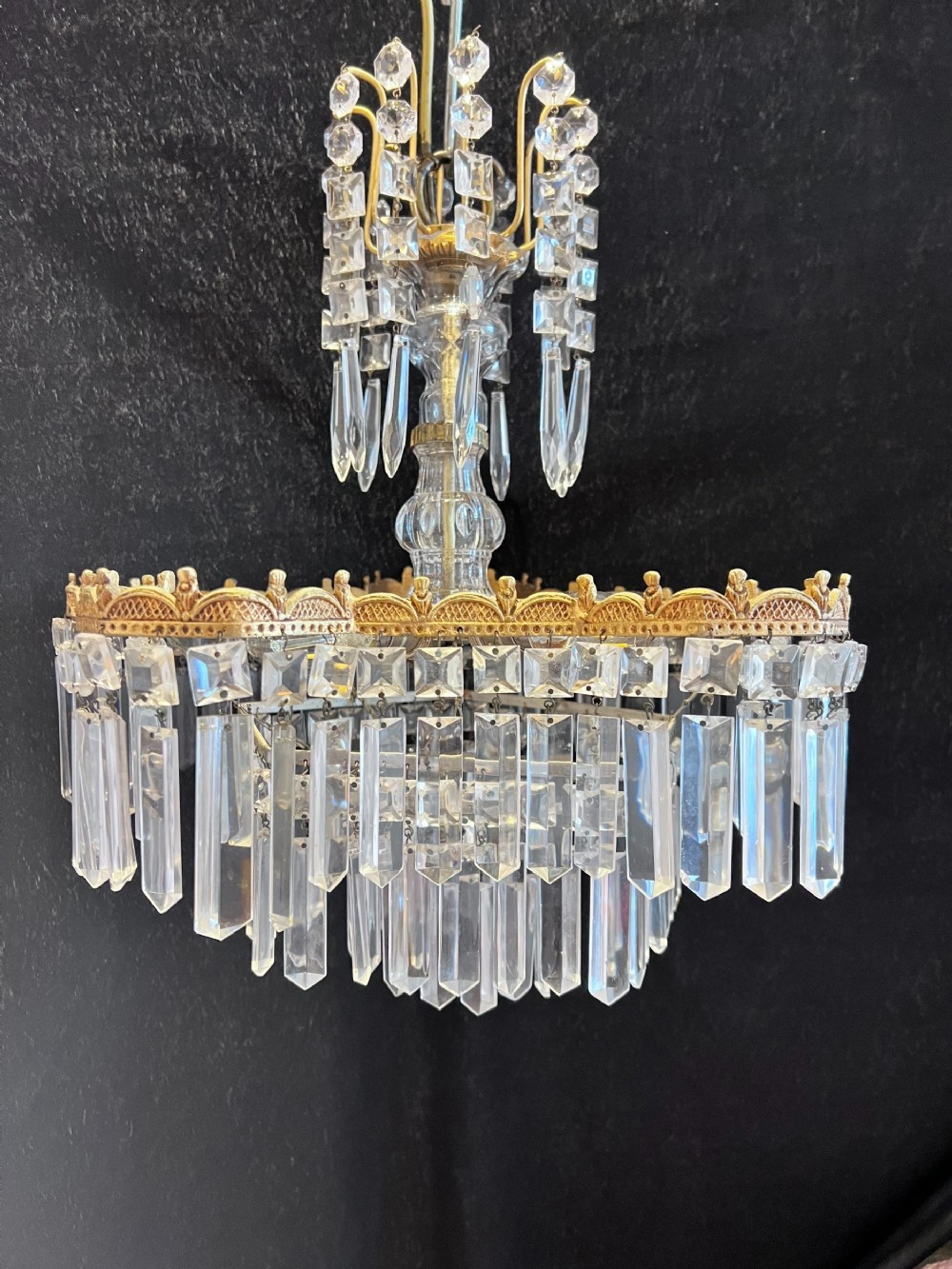 a five light italian brass and crystal antique chandelier in a deco style