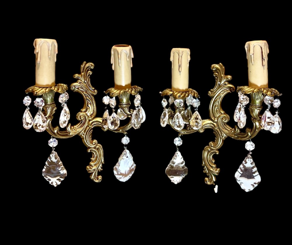 a pair of two light french rococo antique walllights