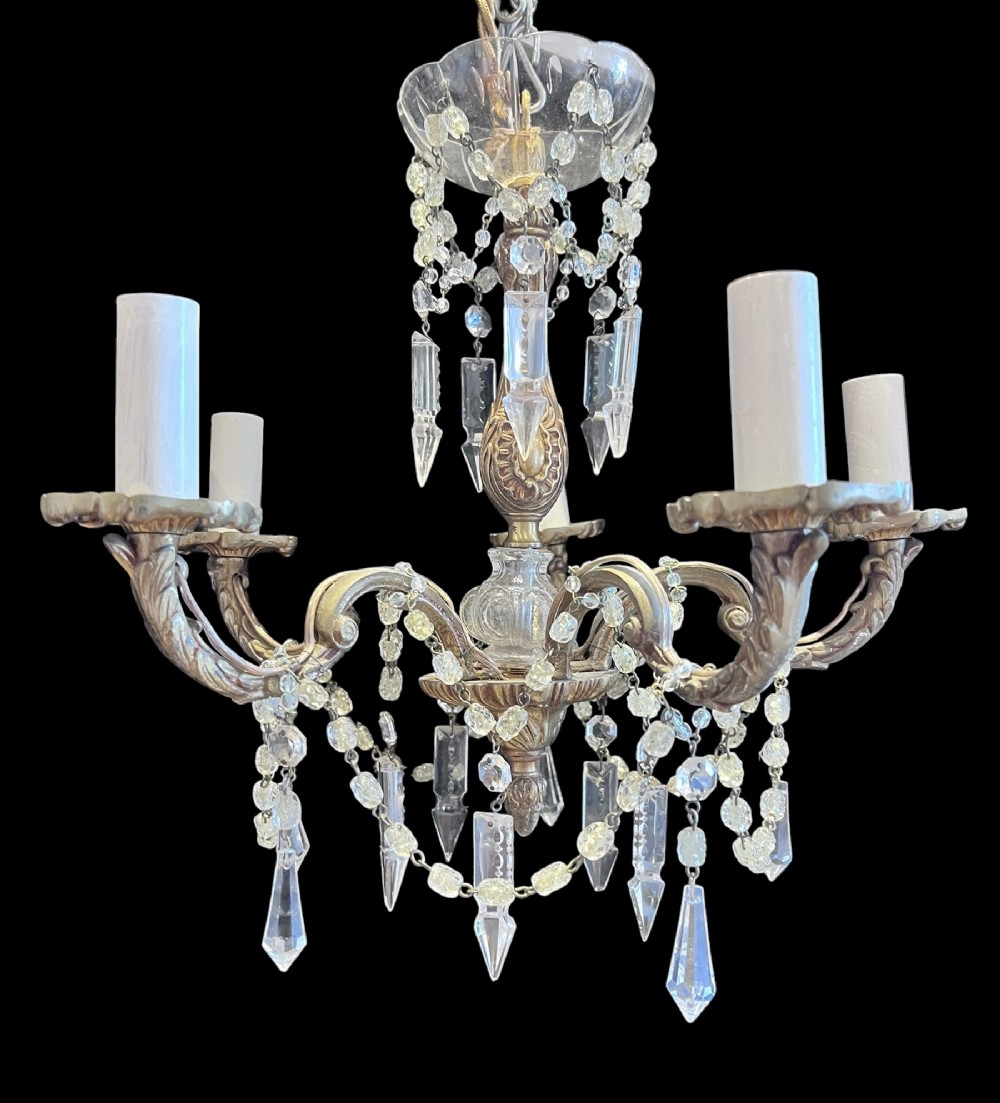 a small five light italian brass and crystal chandelier